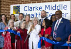 From left to right, College of Family and Consumer Sciences Dean Anisa Zvonkovic, College of Public Health Dean Marsha Davis and Medical Partnership Campus Dean Dr. Shelley Nuss join Medical Director of the Athens Free Clinic and Clarke Middle Health Center Dr. Suzanne Lester as she cuts the ribbon along with School of Law Dean Usha Rodrigues and Clarke County School Superintendent Robbie Hooker at the ribbon cutting ceremony at the Clarke Middle Health Center at Clarke Middle School. (Andrew Davis Tucker/UGA)